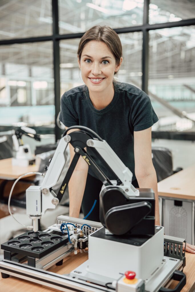 portrait smart woman robot engineer programmer work in robotic l